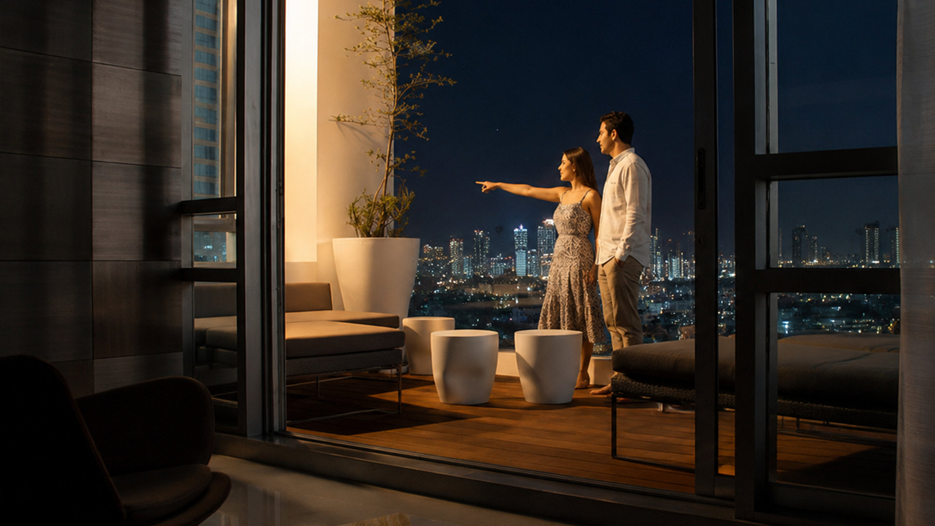 Couple enjoying a luxury residential balcony overlooking the city